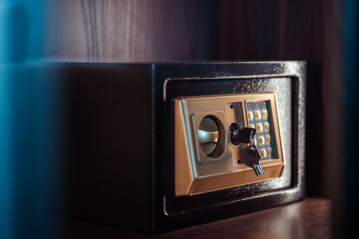 Small electronic safe with a keypad and override key in the lock