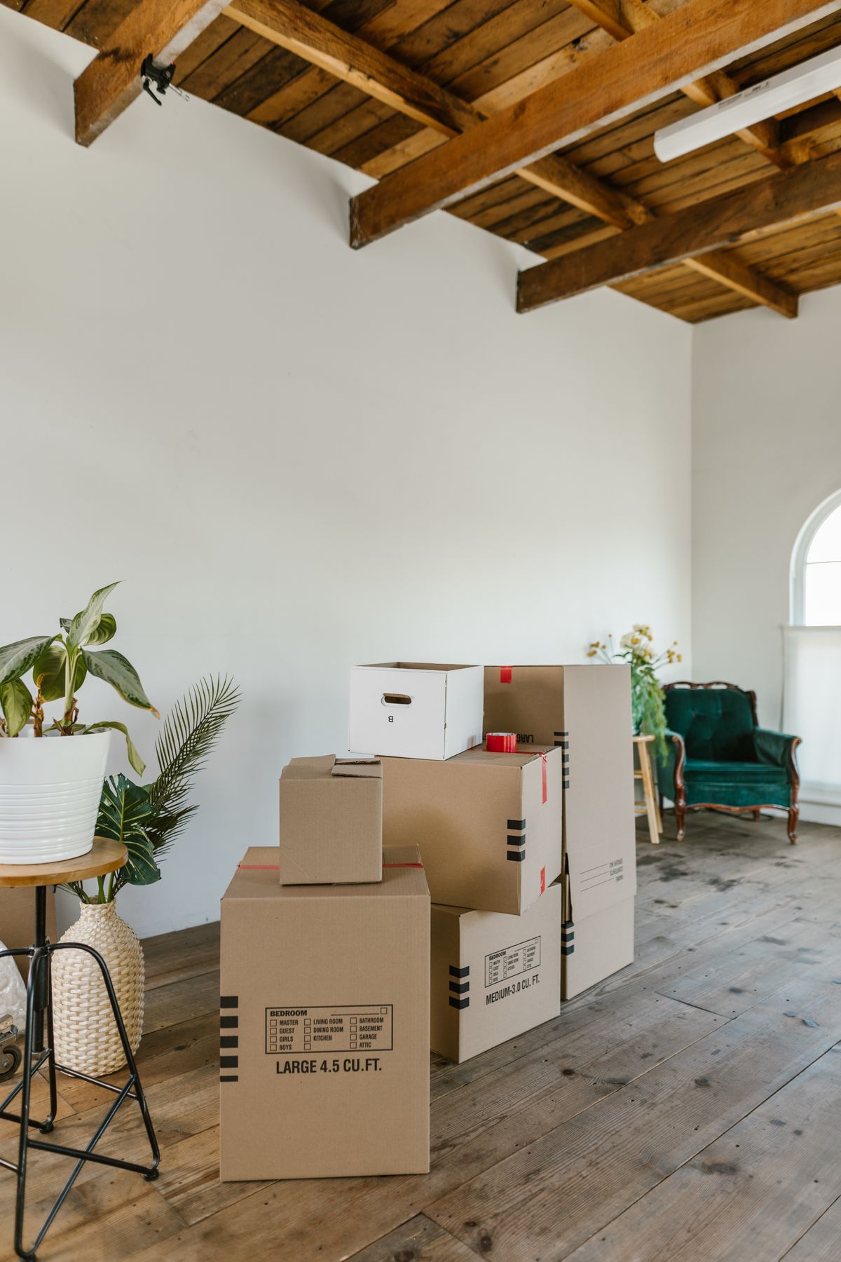 Moving boxes in an empty new apartment — locks belong at the top of the move-in list