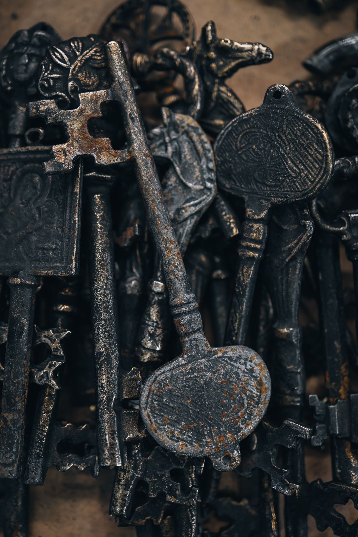 A pile of ornate old iron keys