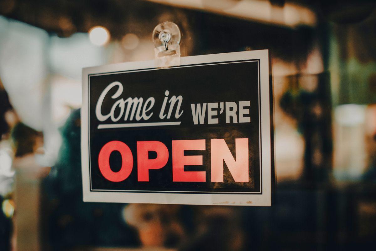 Come in we are open sign on a small business door