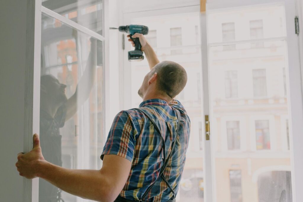 Professional working with a drill during a home installation